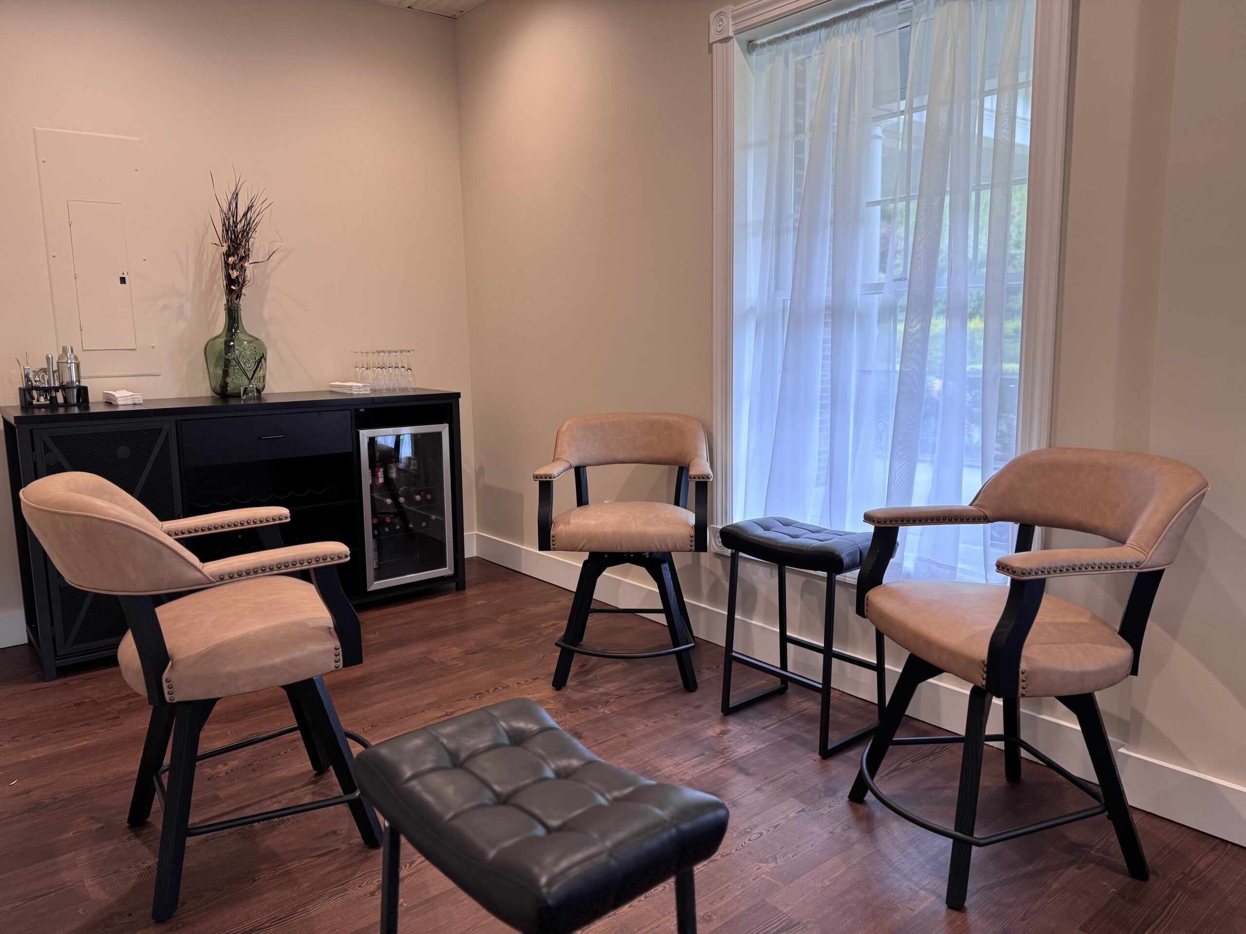 Cozy lounge with chairs and counter.