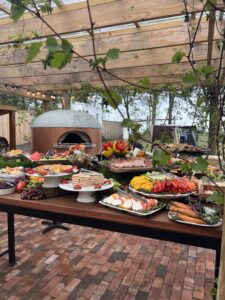 The Vineyard Cocktail food wide with pizza oven bkgd