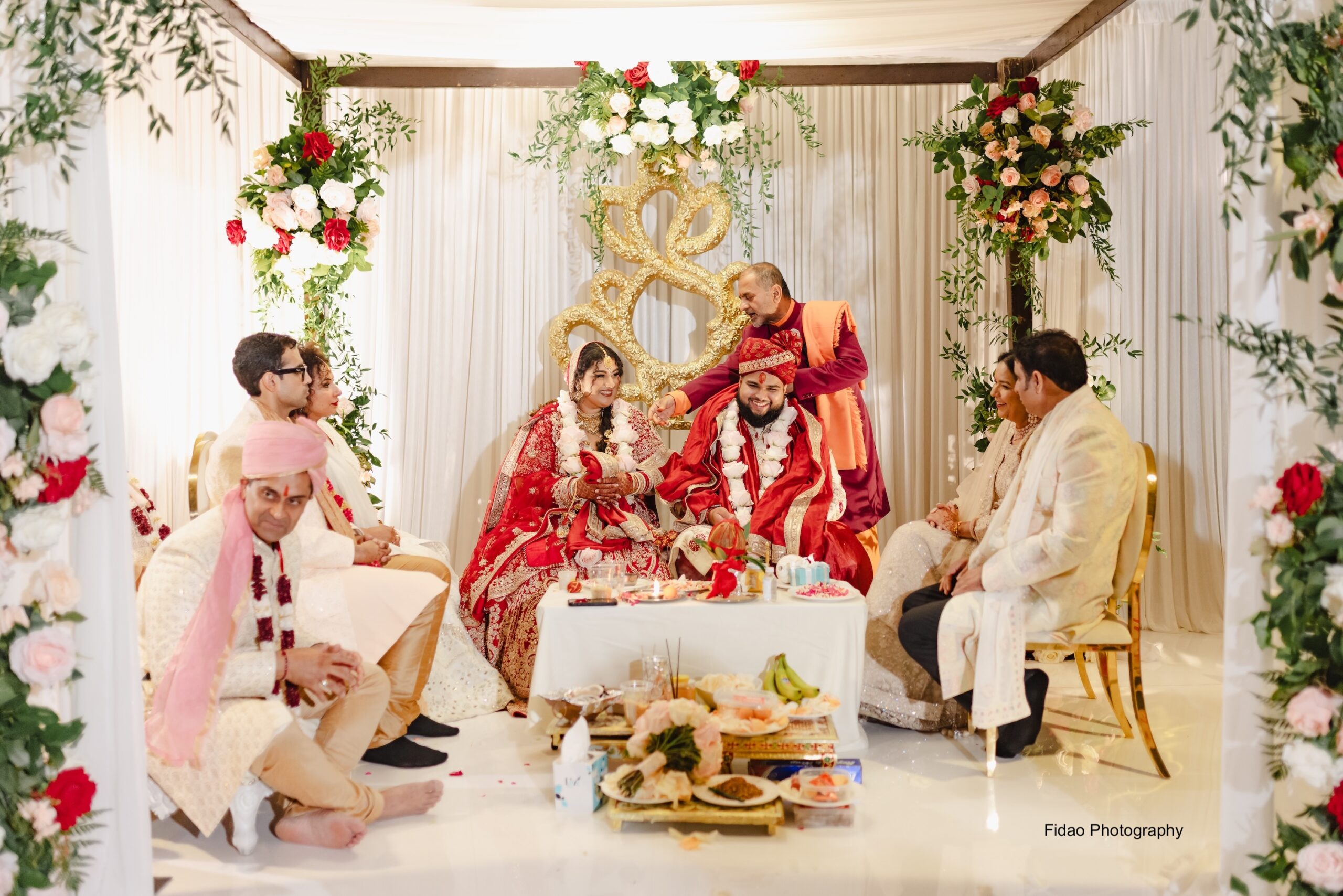 Indian wedding ceremony with vibrant decor.