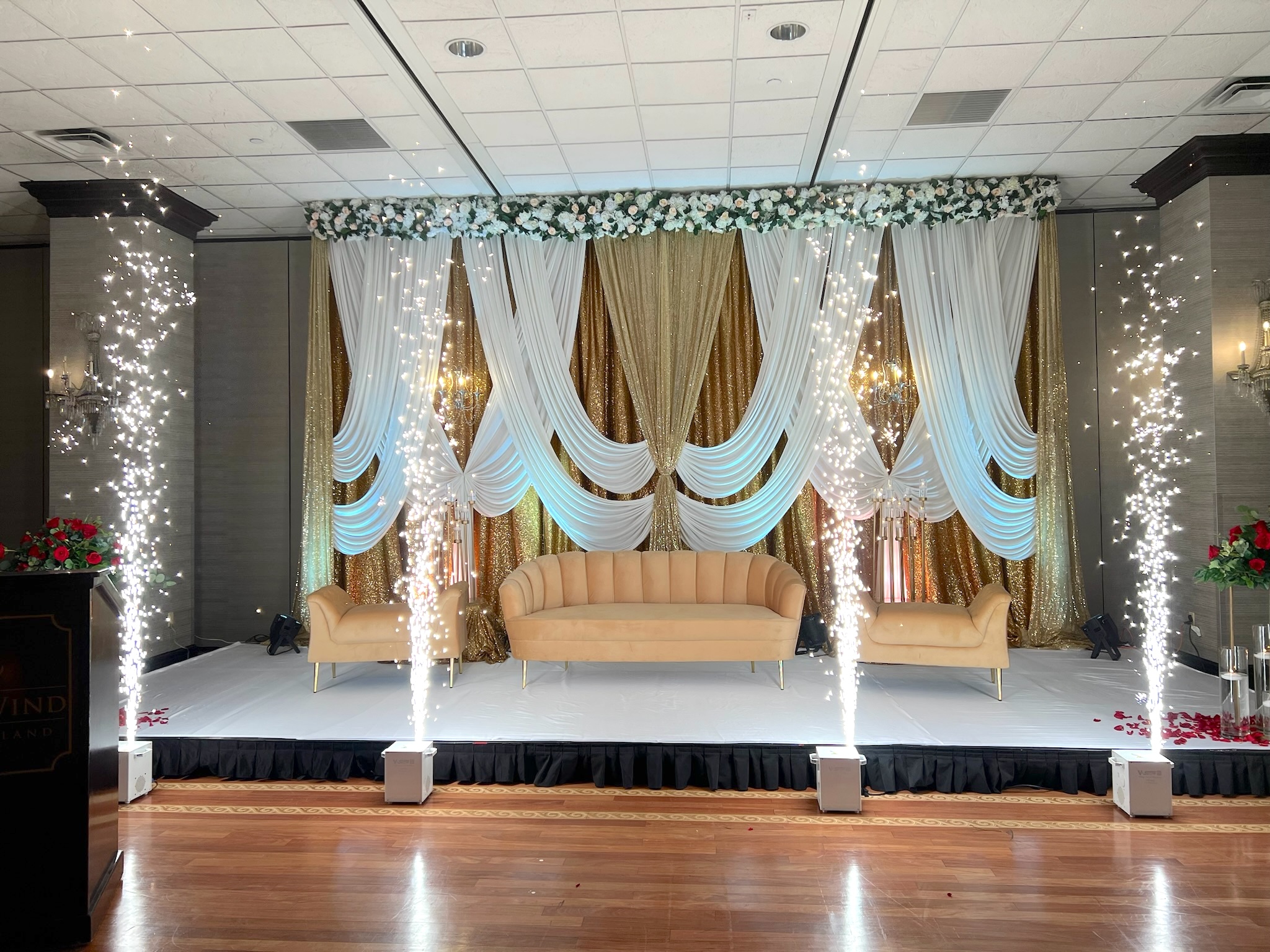 Elegant event stage with sparkling decorations.