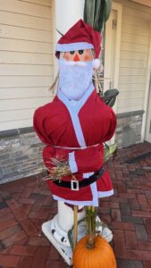 Santa scarecrow and pumpkin display