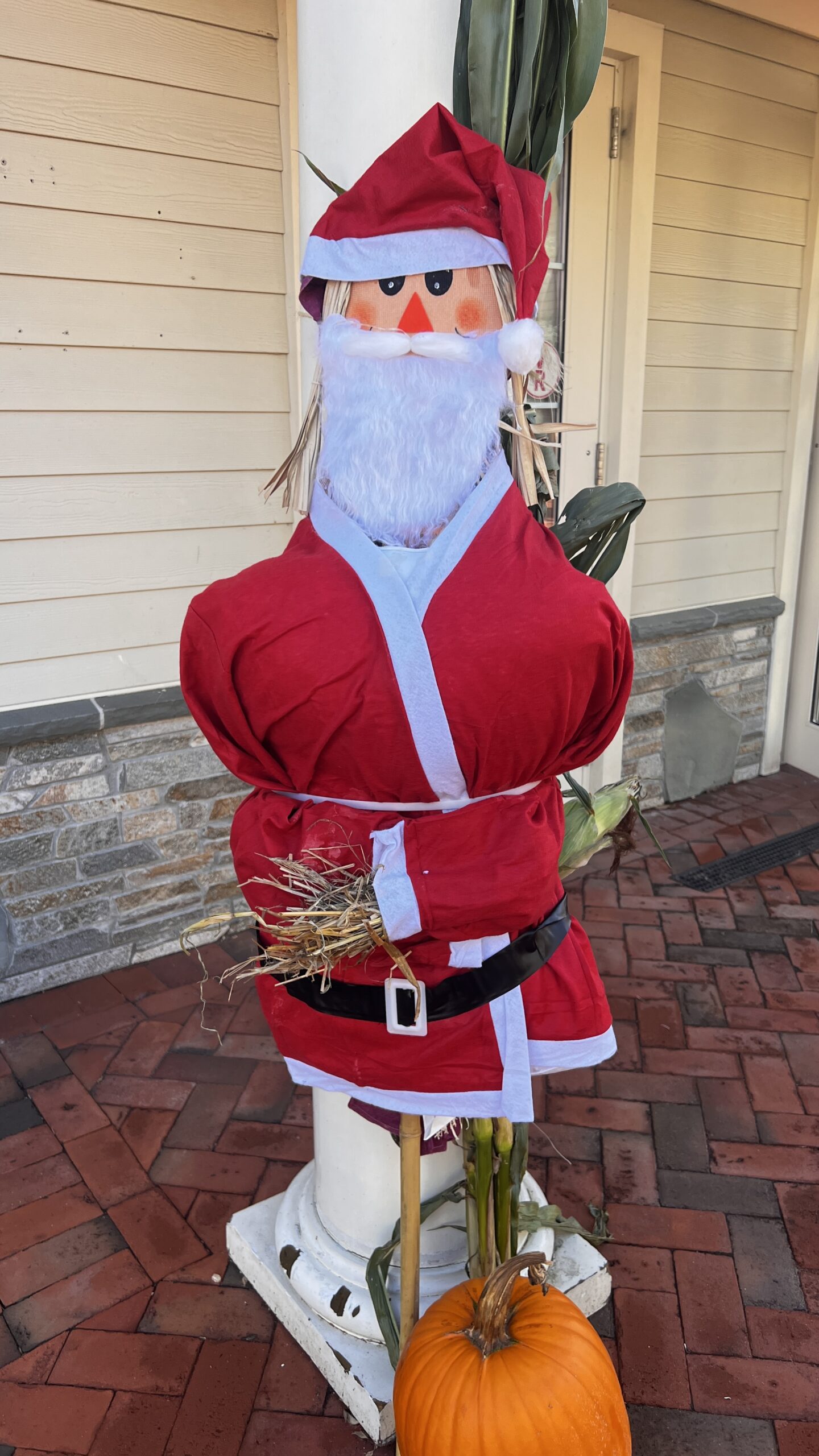 Santa scarecrow and pumpkin display