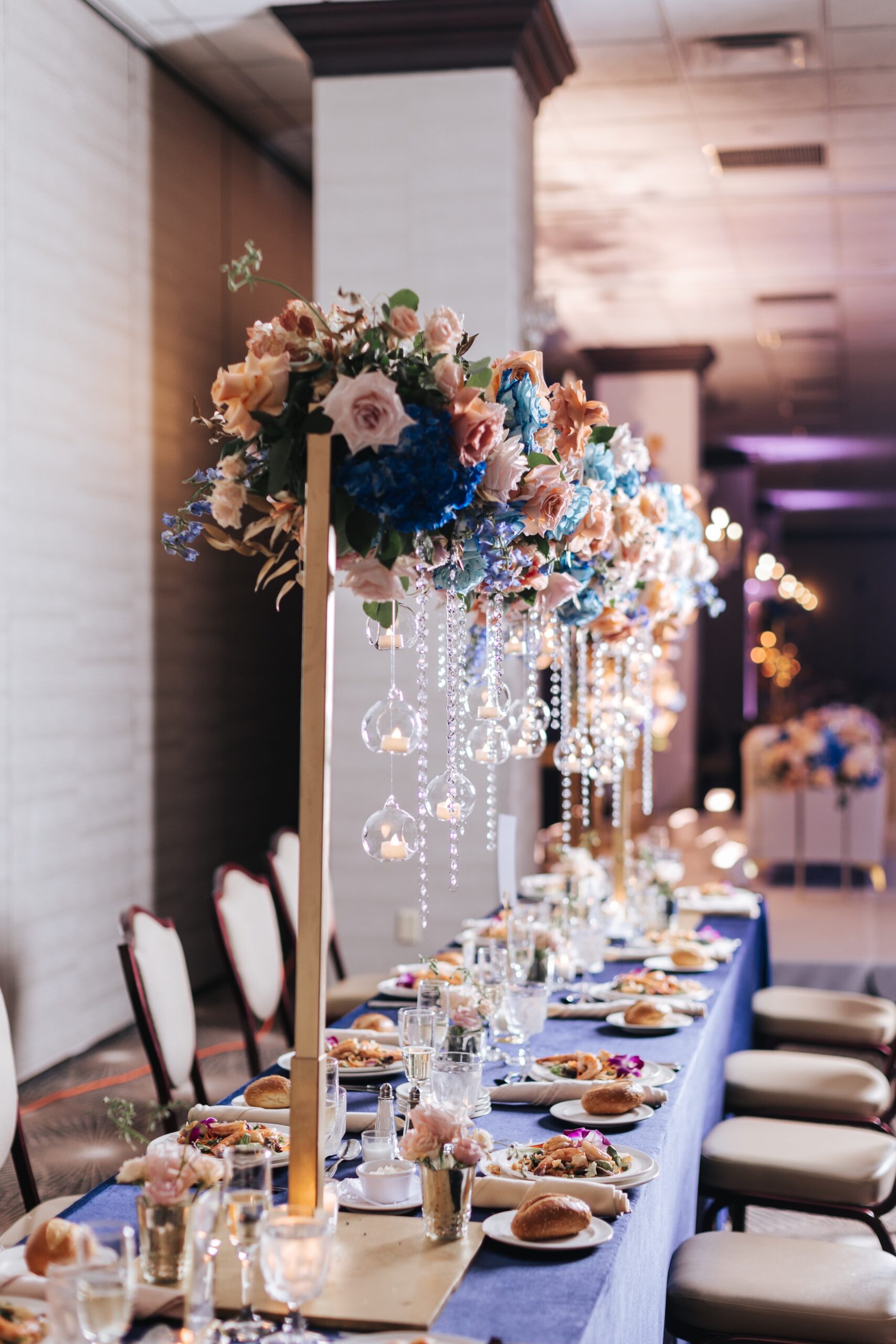 Elegant wedding reception table with floral decor.