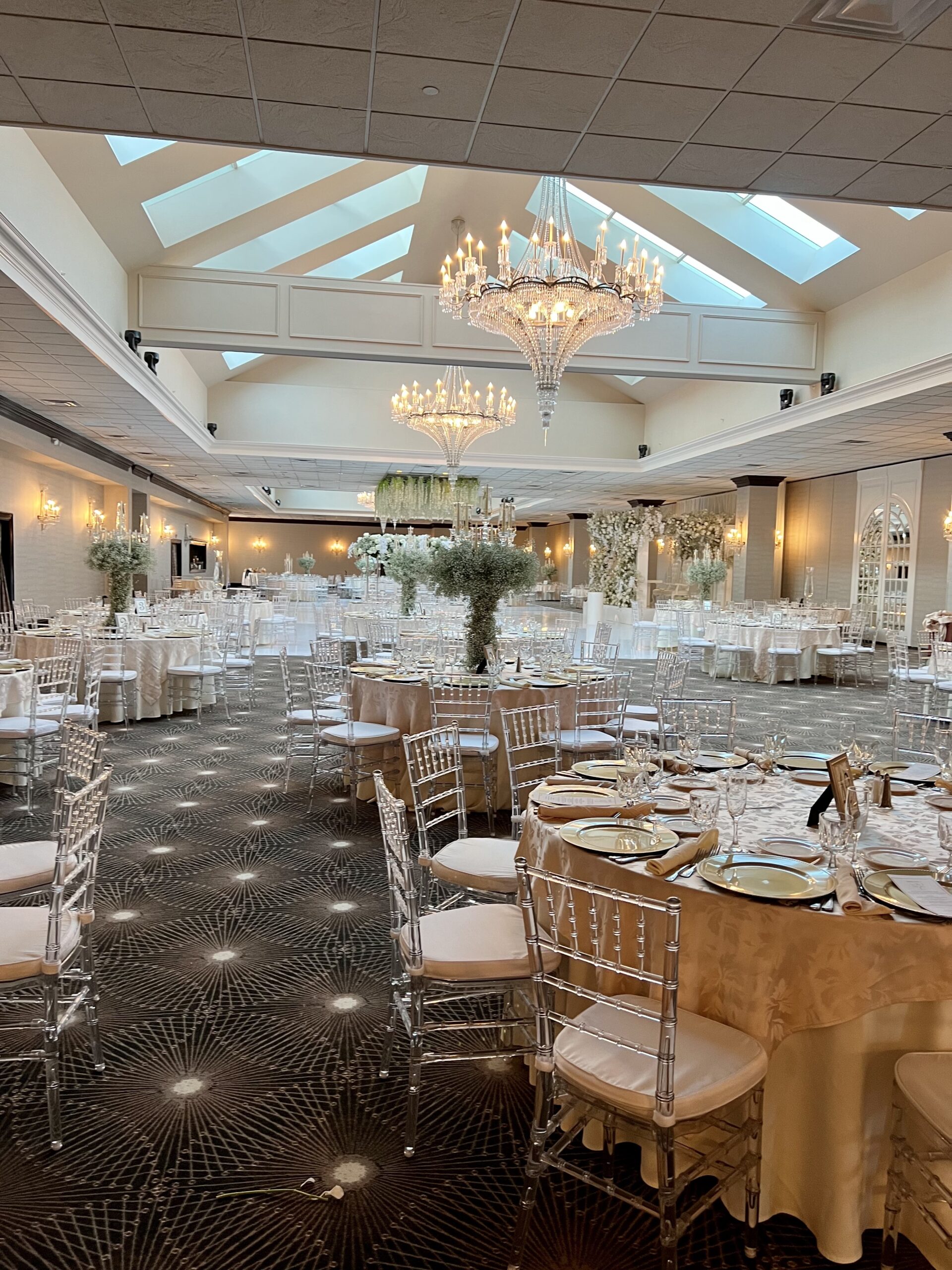Elegant banquet hall with chandeliers and decor
