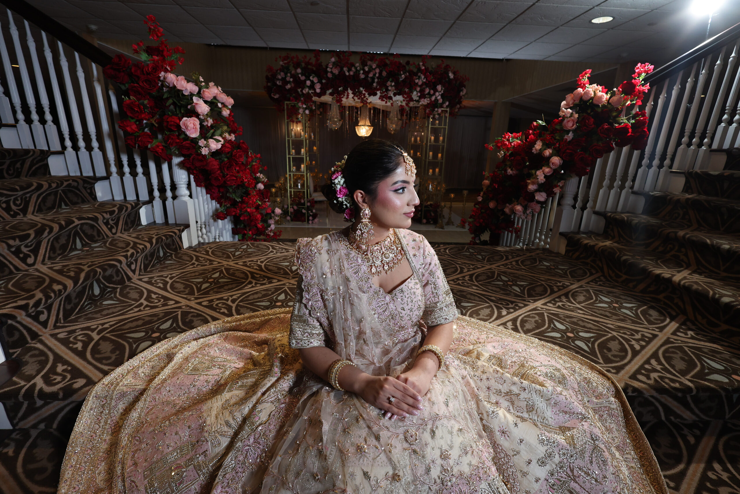 Elegant bride in ornate dress, stunning decor.