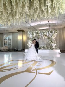 Couple dancing at elegant wedding reception.