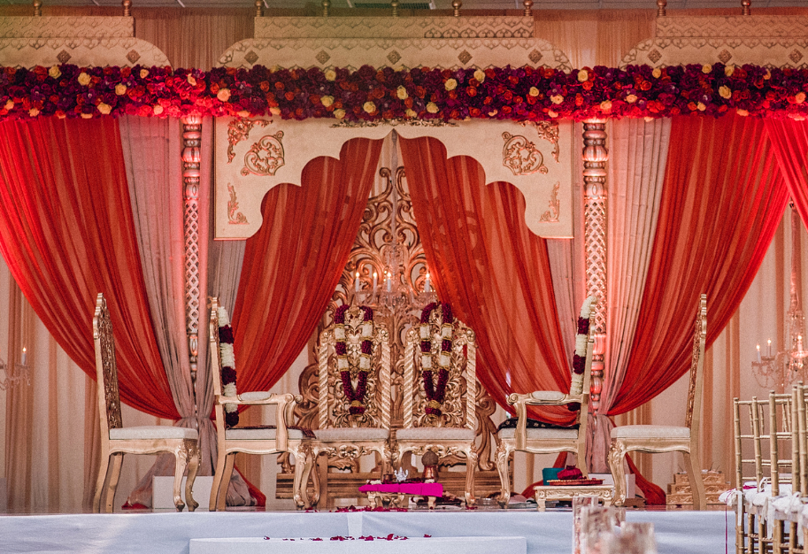 Elegant wedding stage with floral decor.