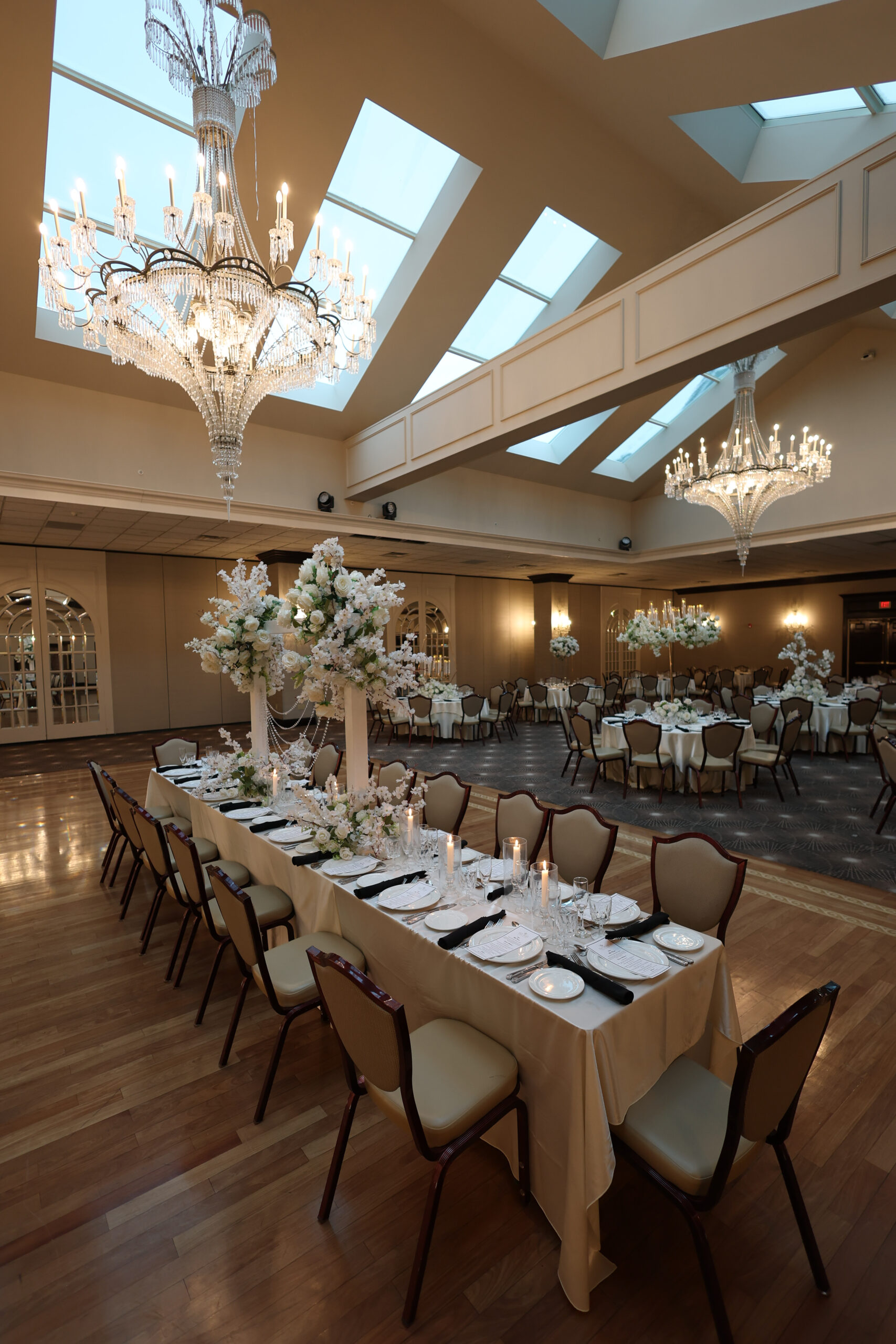Elegant event venue with chandeliers.