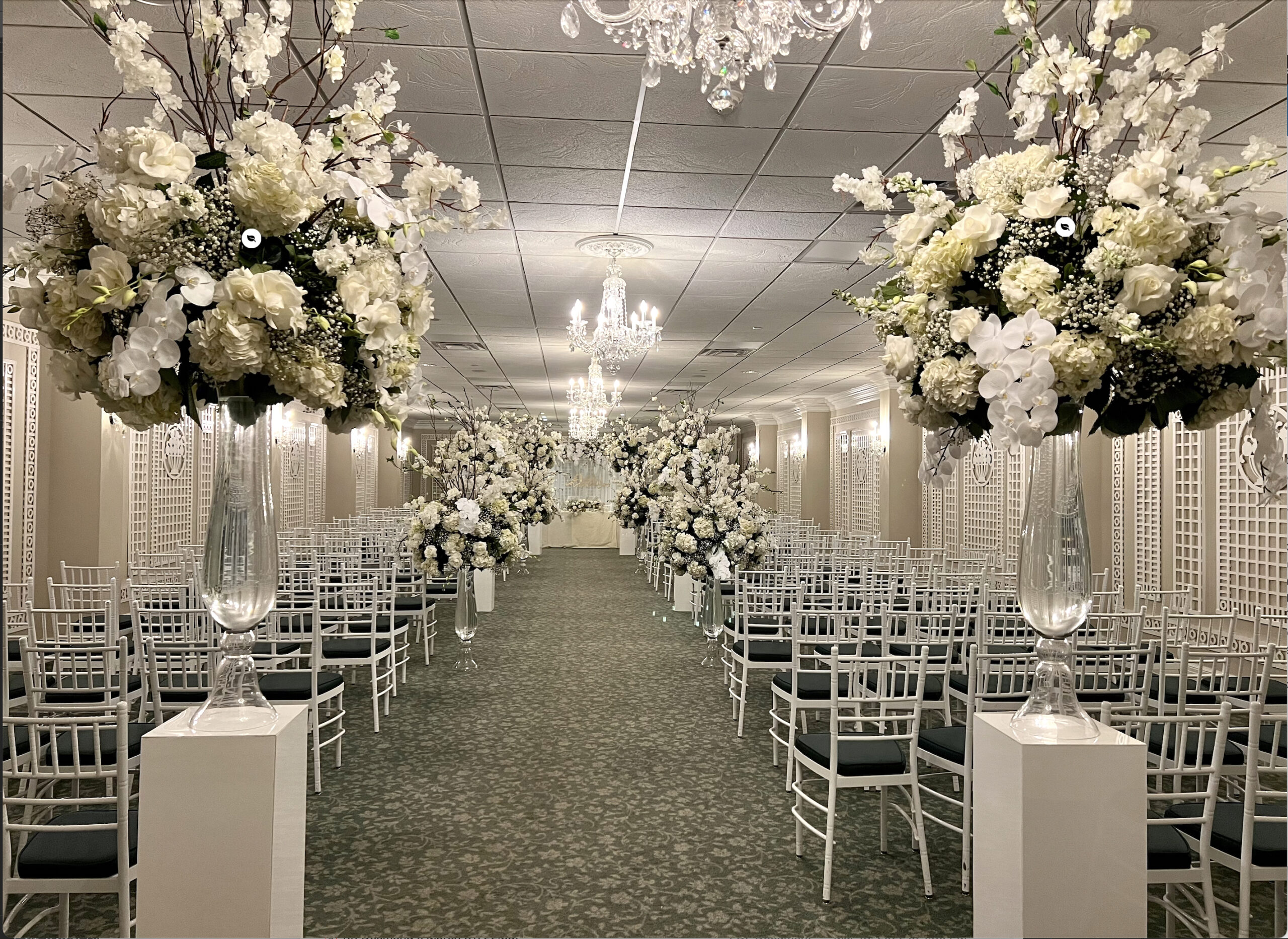 Elegant wedding venue with floral decorations.
