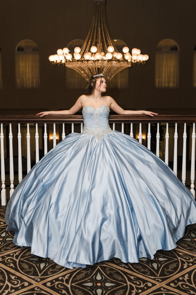 Woman in elegant blue ball gown.