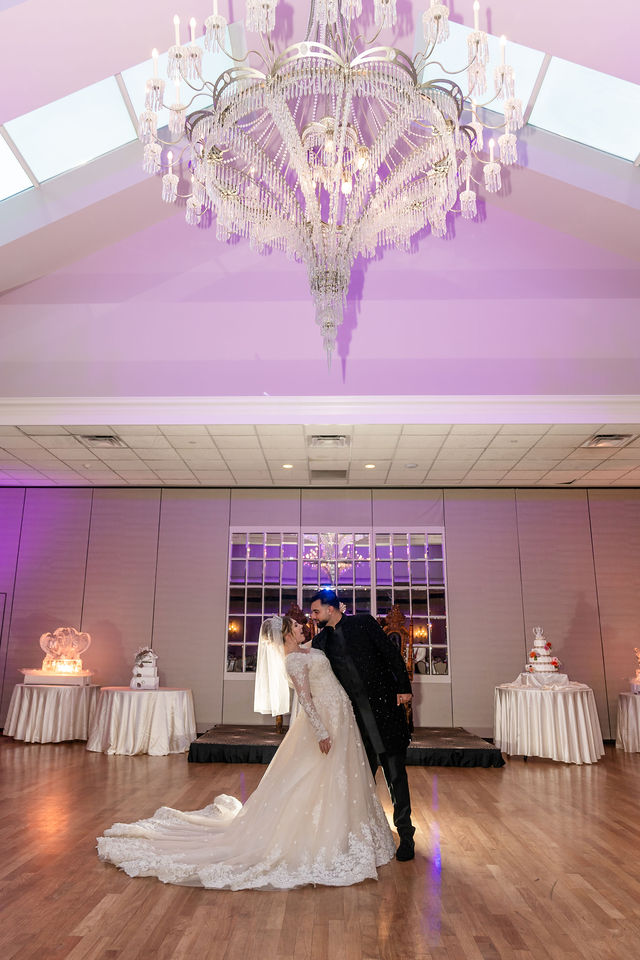 Wedding couple in elegant ballroom.