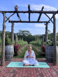 Yoga meditation in a vineyard setting.