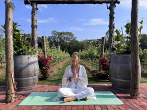 Yoga meditation in a vineyard setting.