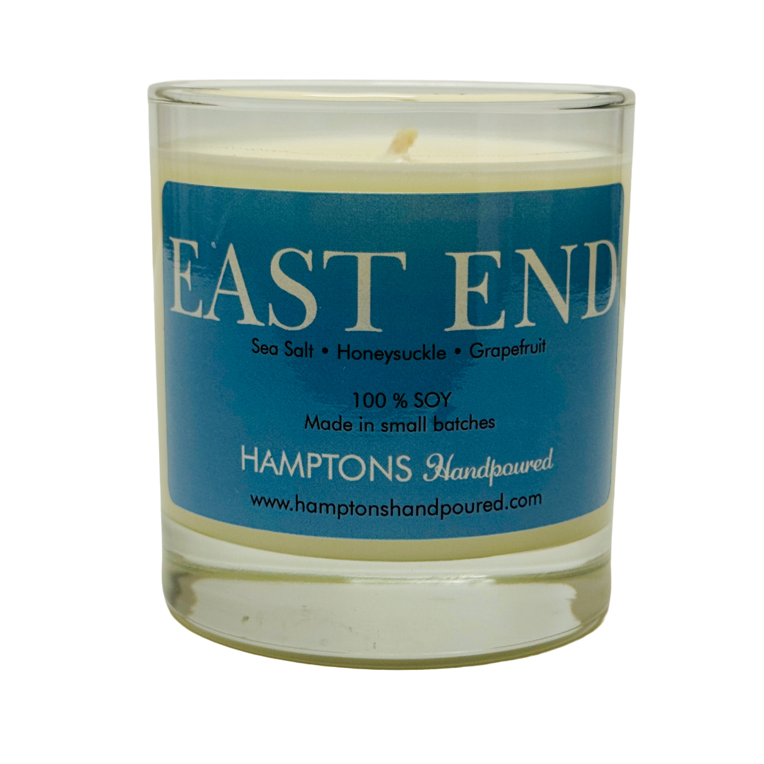 Soy candle with blue label and scents.