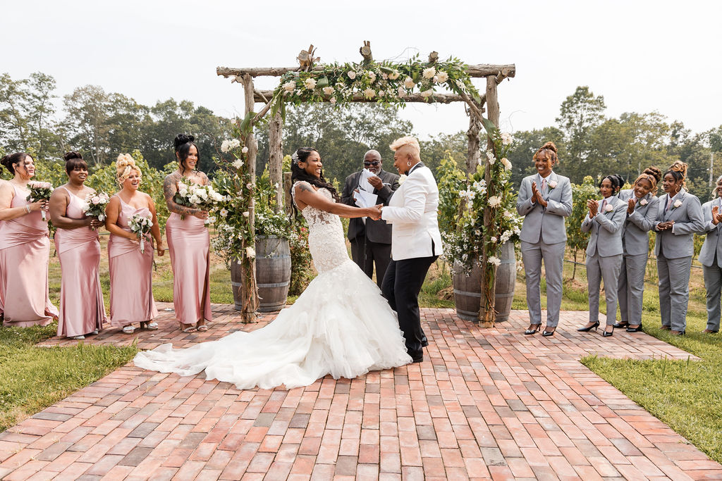 Outdoor wedding ceremony with happy couple